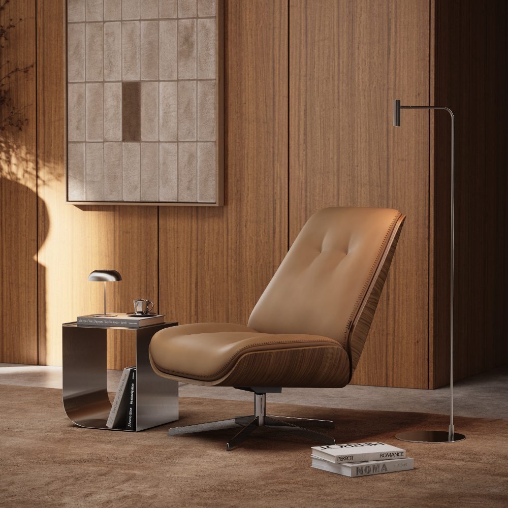 elliot armchair and blog article about hybrid living A contemporary lounge armchair and table arrangement in front of a wall, emphasizing a minimalist aesthetic.