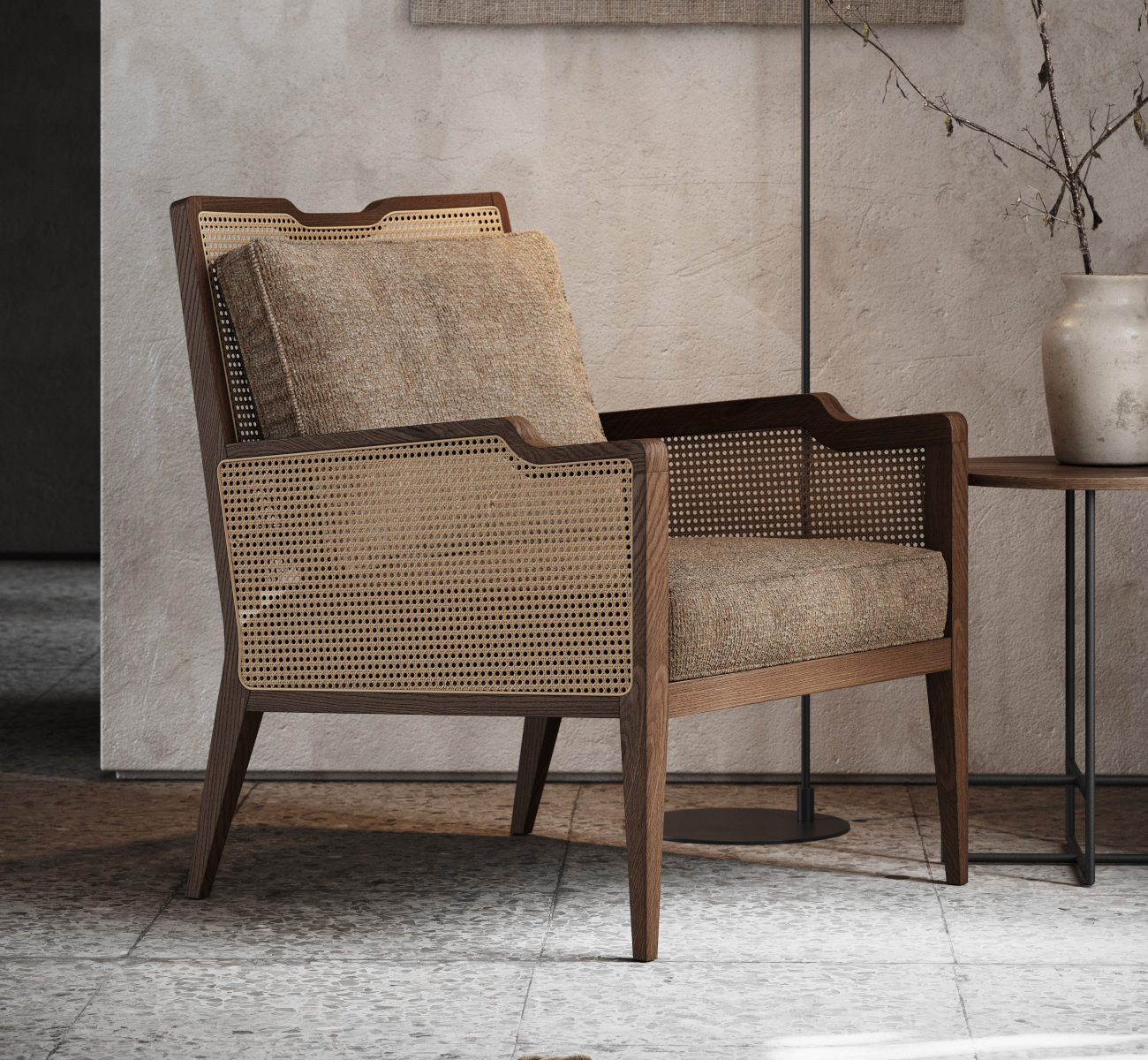 An armchair in wood and rattan and a table set before a wall, illustrating a straightforward and functional interior design.