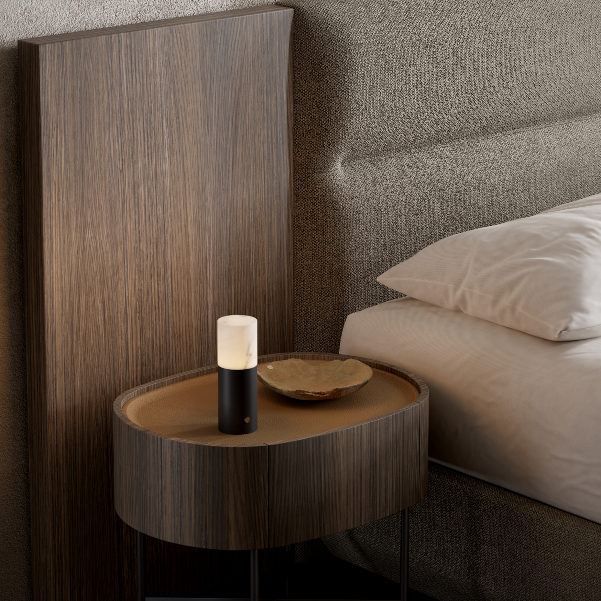 A bedside table with a stylish lamp, providing light and decor for a bedroom setting.