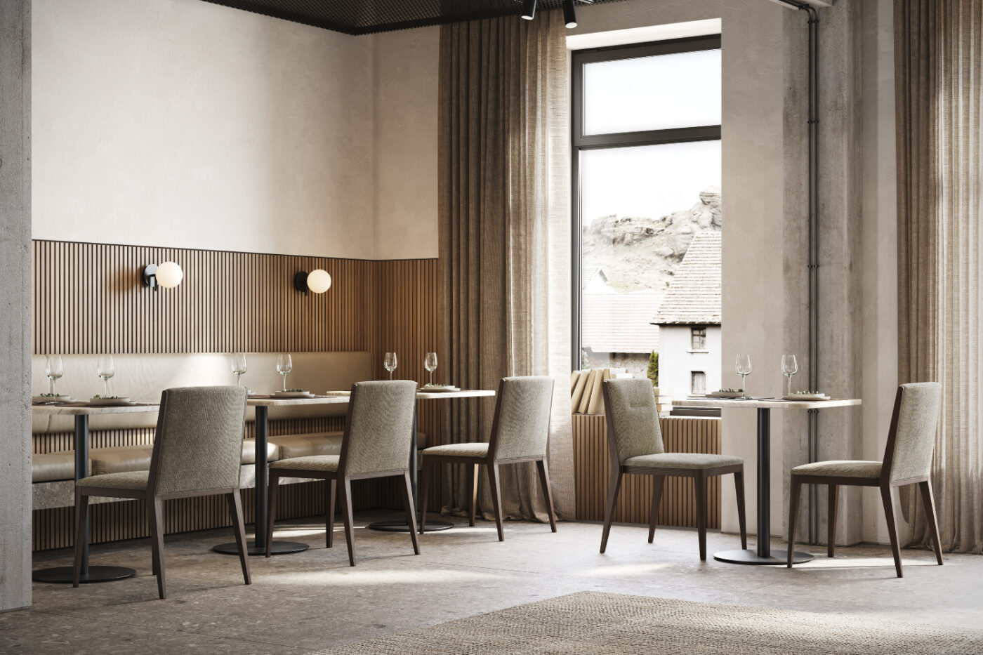 Inside a restaurant, tables and chairs are set up in front of a window, creating a bright and inviting dining atmosphere.