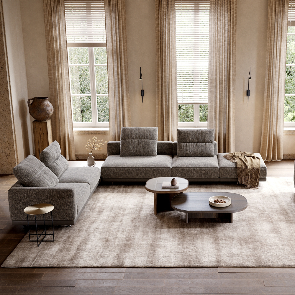 A cosy living room featuring a modular sofa, Gilbert coffee tables and a side table, creating a welcoming atmosphere.