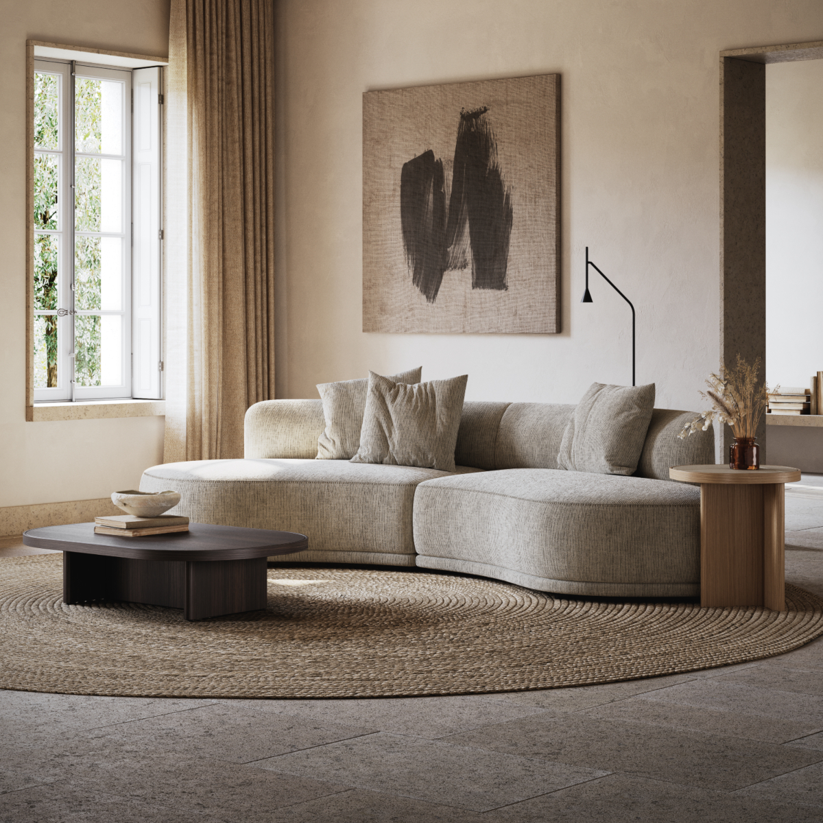 Bright living room showcasing a large modular sofa and gilbert coffee and side table, perfect for relaxation and gatherings.