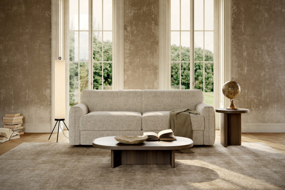 A bright living room showcasing a sofa bed, coffee table and lamp, designed for comfort and casual socialising.