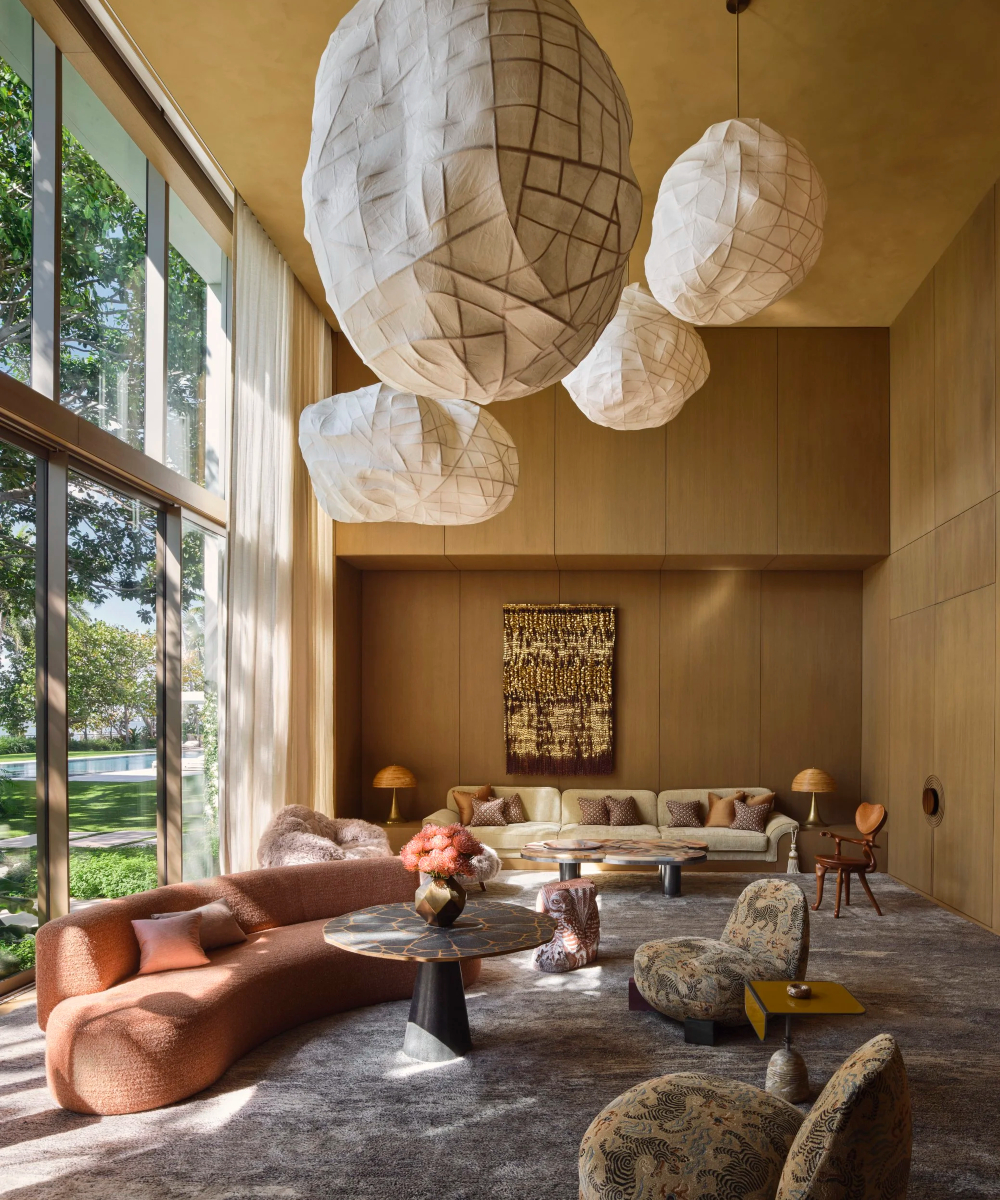 kelly behun project The living room showcases large hanging lamps, adding elegance and warmth to the space. By Kelly Behun, one of the best interior designers in the US