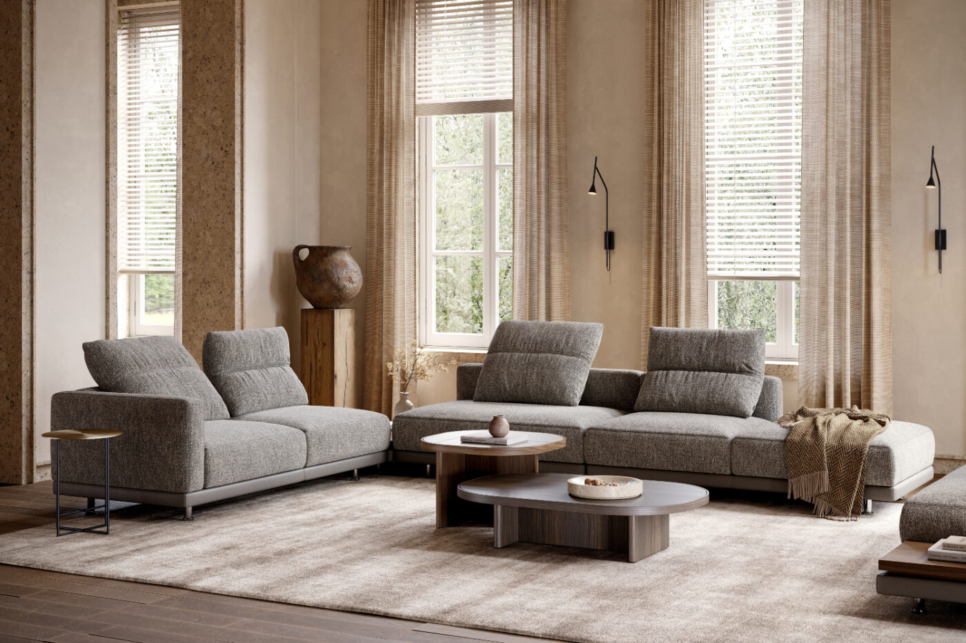 A cosy living room featuring a modular sofa two table sets arranged for comfort and relaxation.