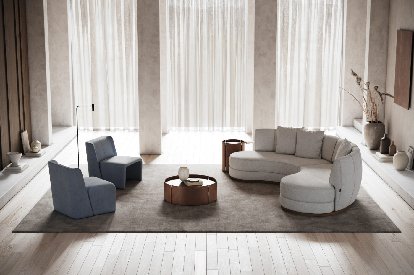 A modern living room showcasing a curved sofa, two armchairs and a centre table, designed for comfort and conversation. Trendy or timeless