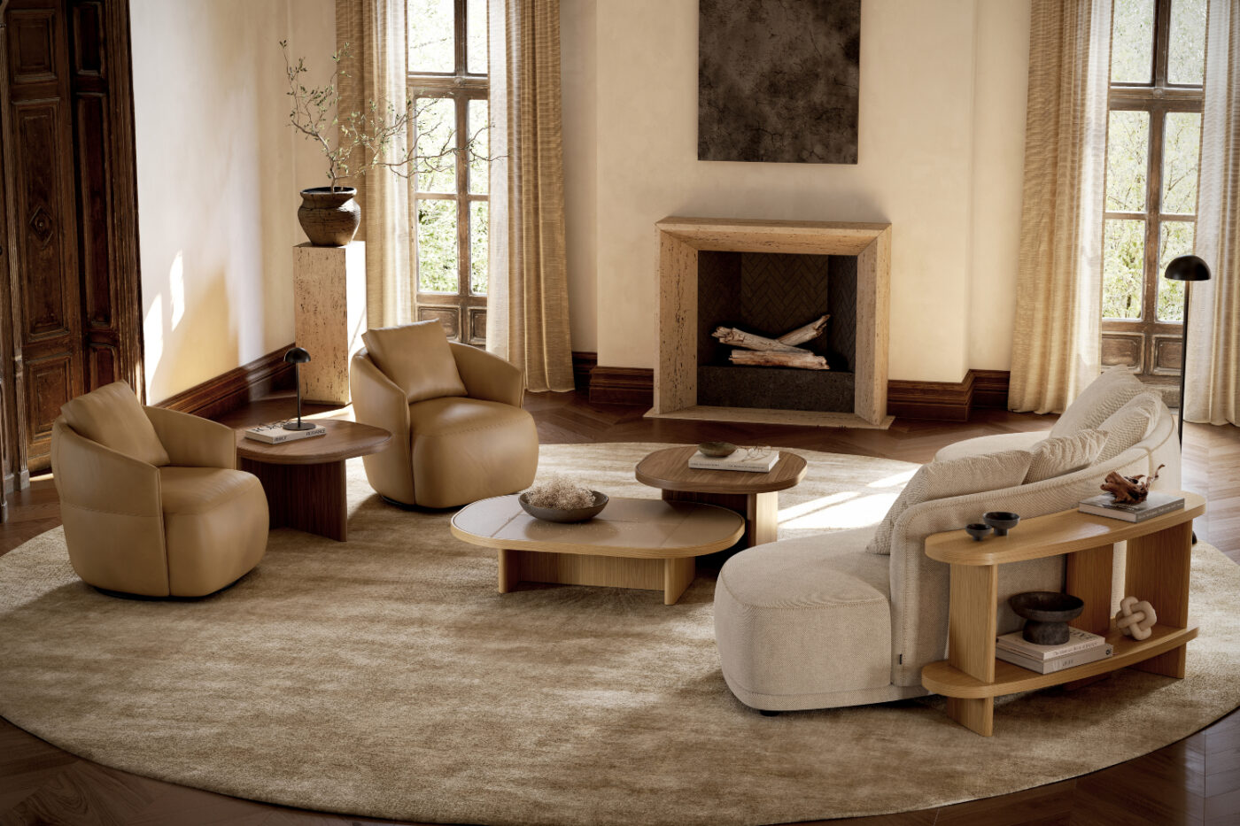 A cosy living room featuring a fireplace and a round rug, creating a warm and inviting atmosphere. With two armchairs in brown leather, a curver sofa, a curved console and a table set with three tables. Room by room.