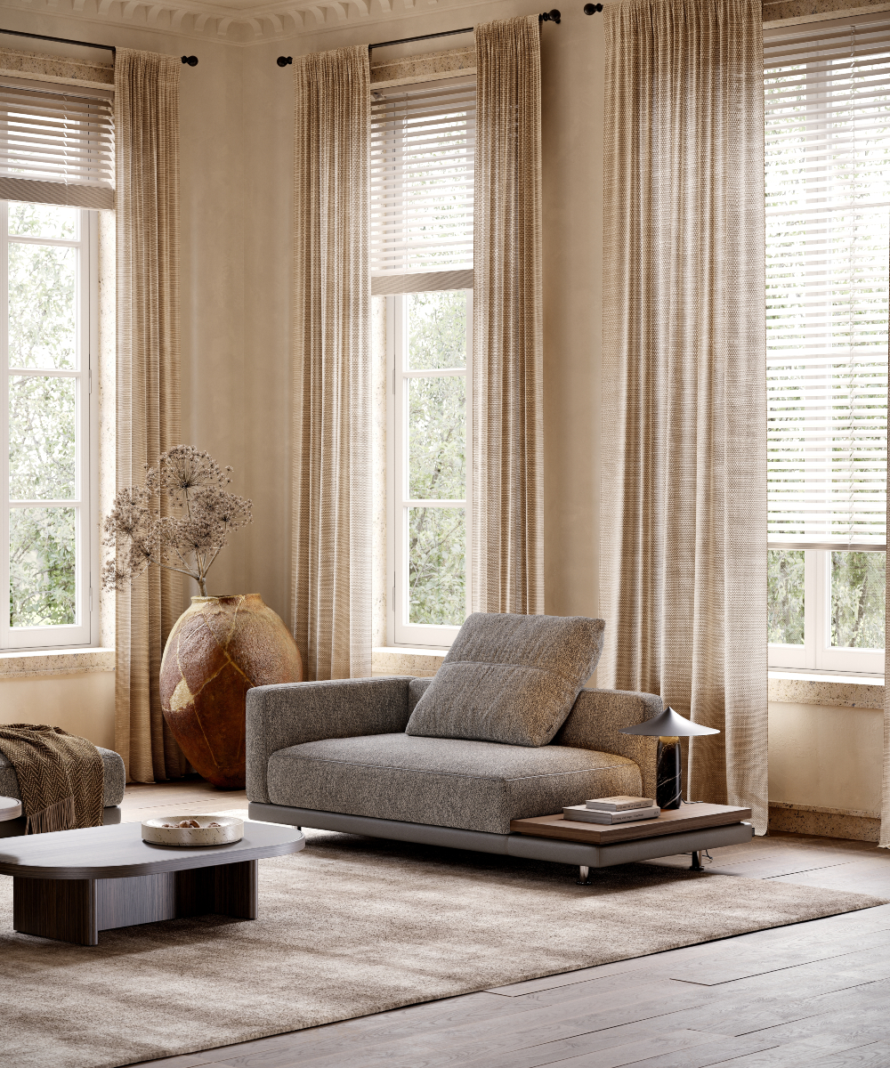 A bright living room with a comfortable modular sofa, a coffee table, and a window showcasing outdoor views. With natural design.
