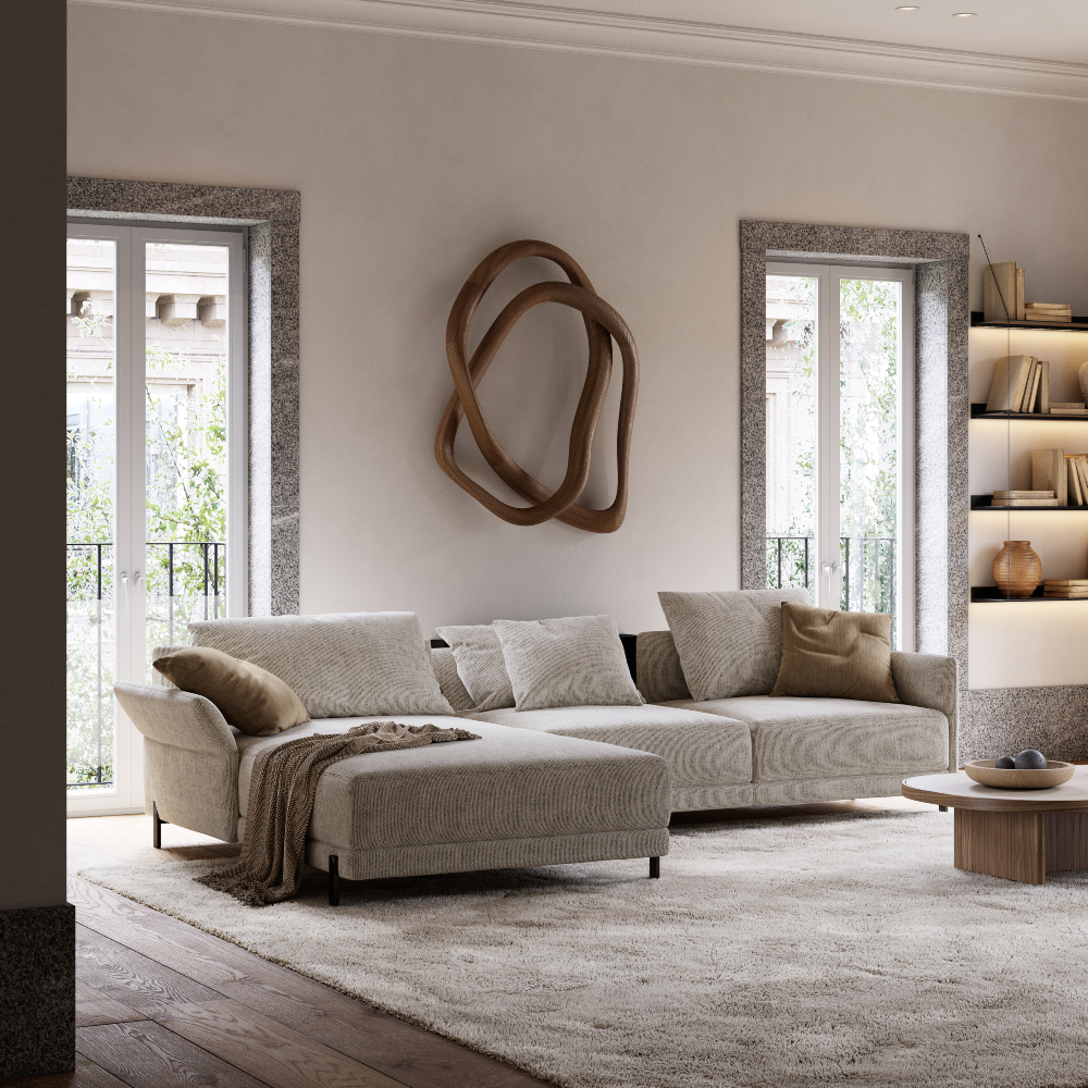 Well-furnished living room with a comfortable sofa, a coffee table, and a neatly arranged bookshelf.