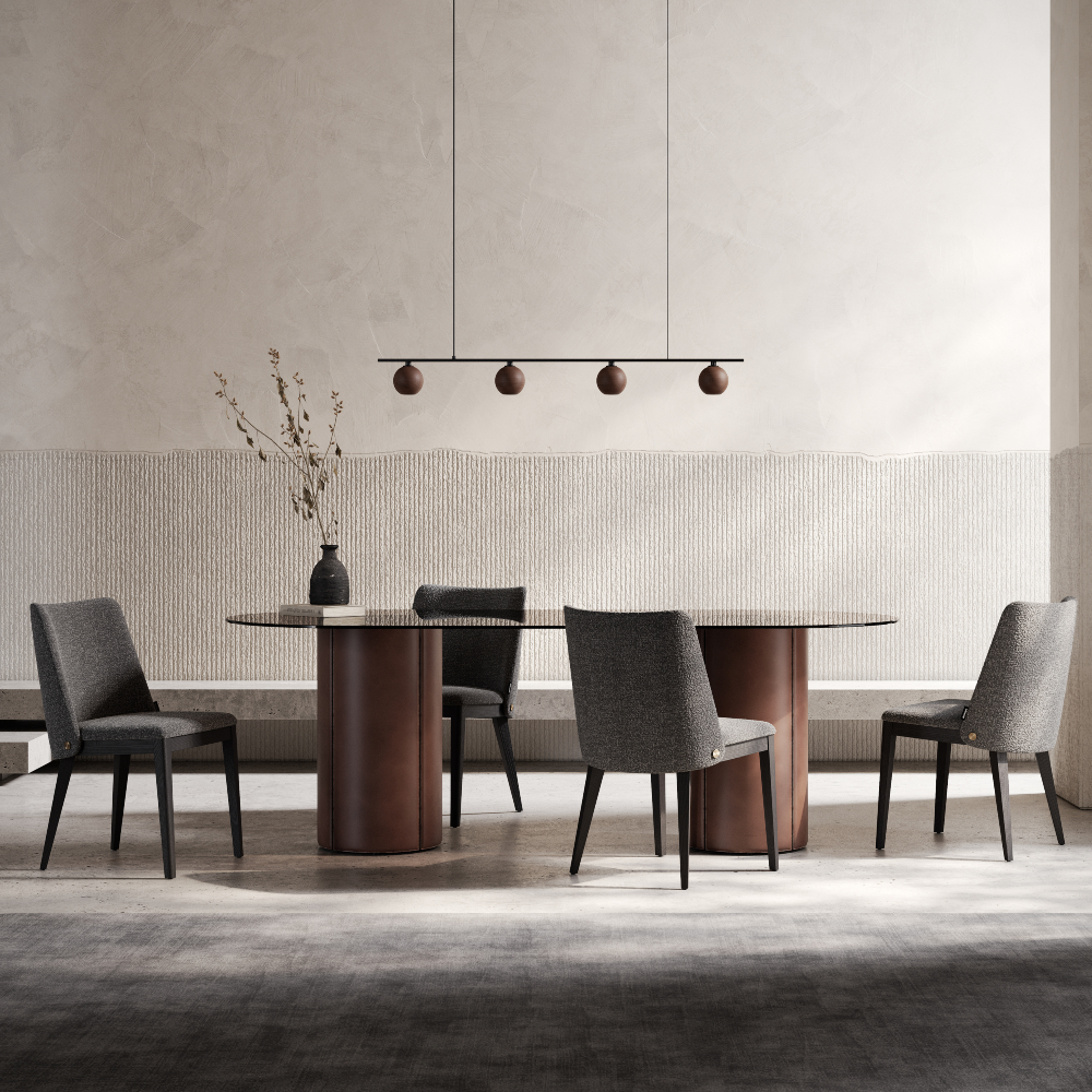 A modern dining room featuring a sleek table surrounded by stylish chairs.