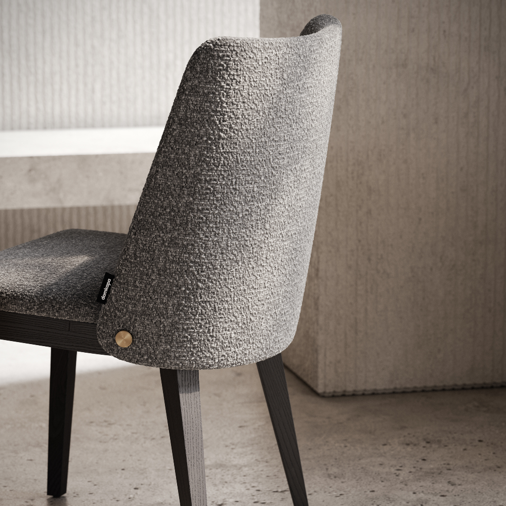 A chair showcasing a grey upholstered seat, blending functionality and aesthetic appeal in home or office environments.