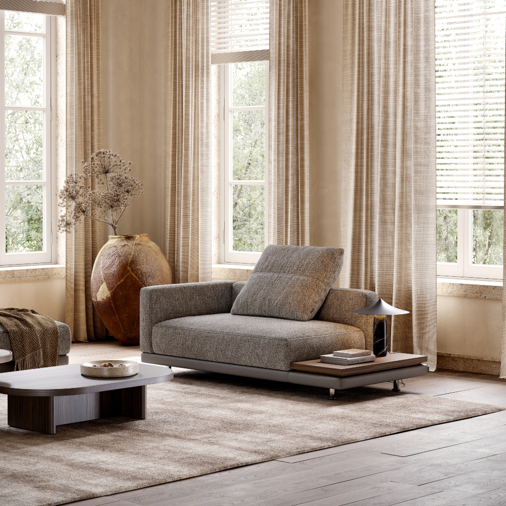 Module from a sofa upholstered in dark fabric in a minimalist living room.