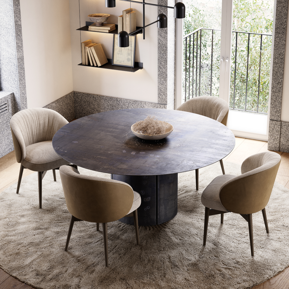 A round dining table with four matching chairs, featuring a contemporary round lamp hanging above. 2025 dining room trends.