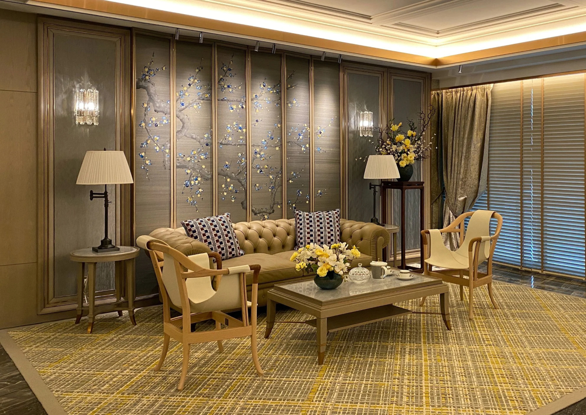 A modern living room in Asia showcasing a big screen and a stylish sofa, creating an inviting space for leisure activities.