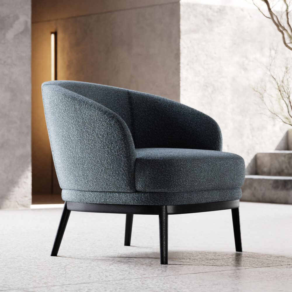 A sleek modern armchair, positioned in a minimalist room featuring a textured concrete wall.
