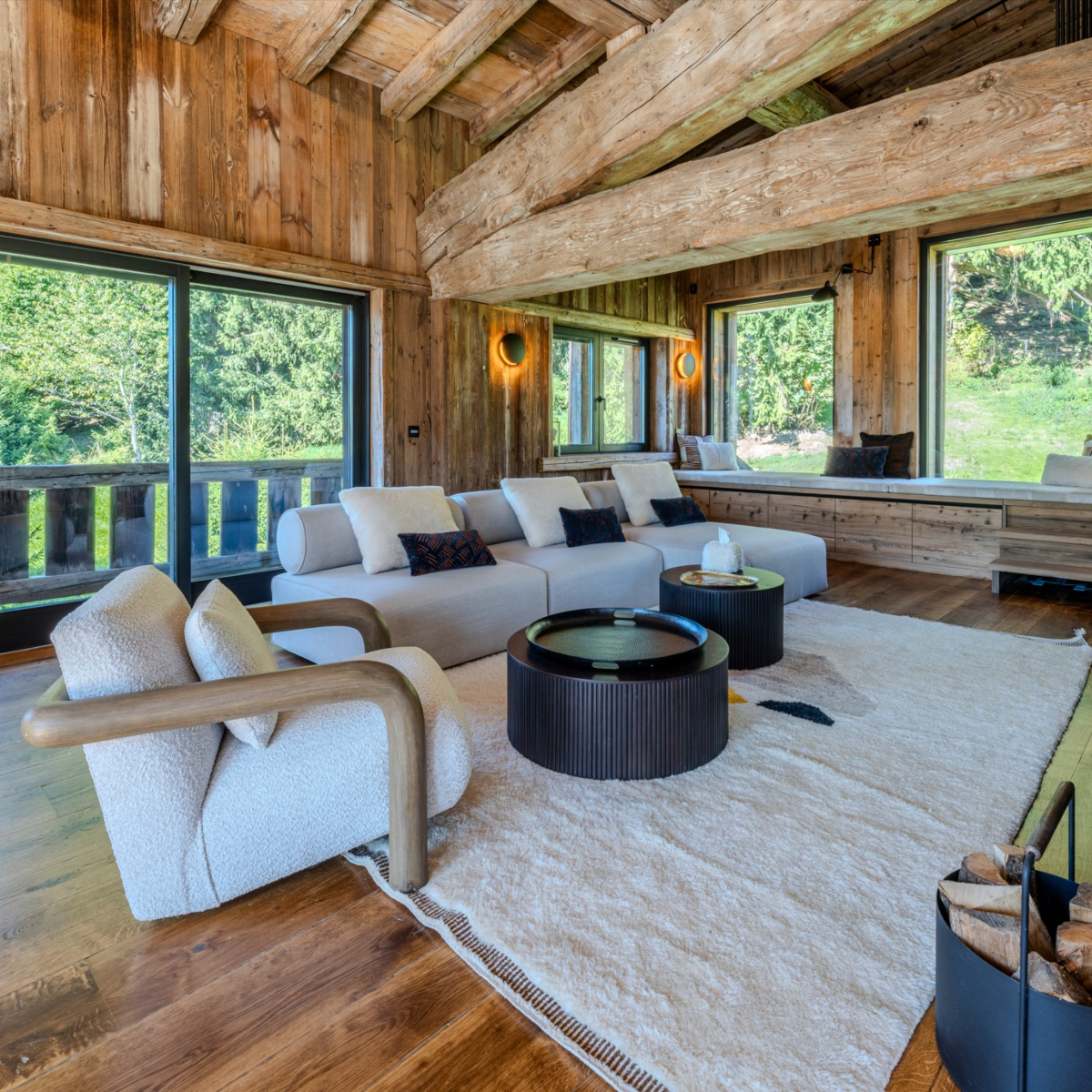 shinto modular sofa in an aloona design project A charming living room adorned with wooden walls and a modular sofa, enhancing the room's warmth and character. By Aloona Design