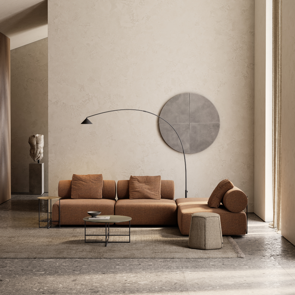 A modern living room featuring a large round light fixture, stylish furniture, and neutral colour tones. Design around the world - scandinavian style.