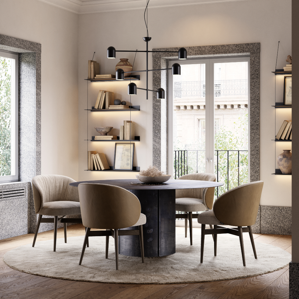 A well-furnished room showcasing a round table and chairs, designed for family gatherings and meals.